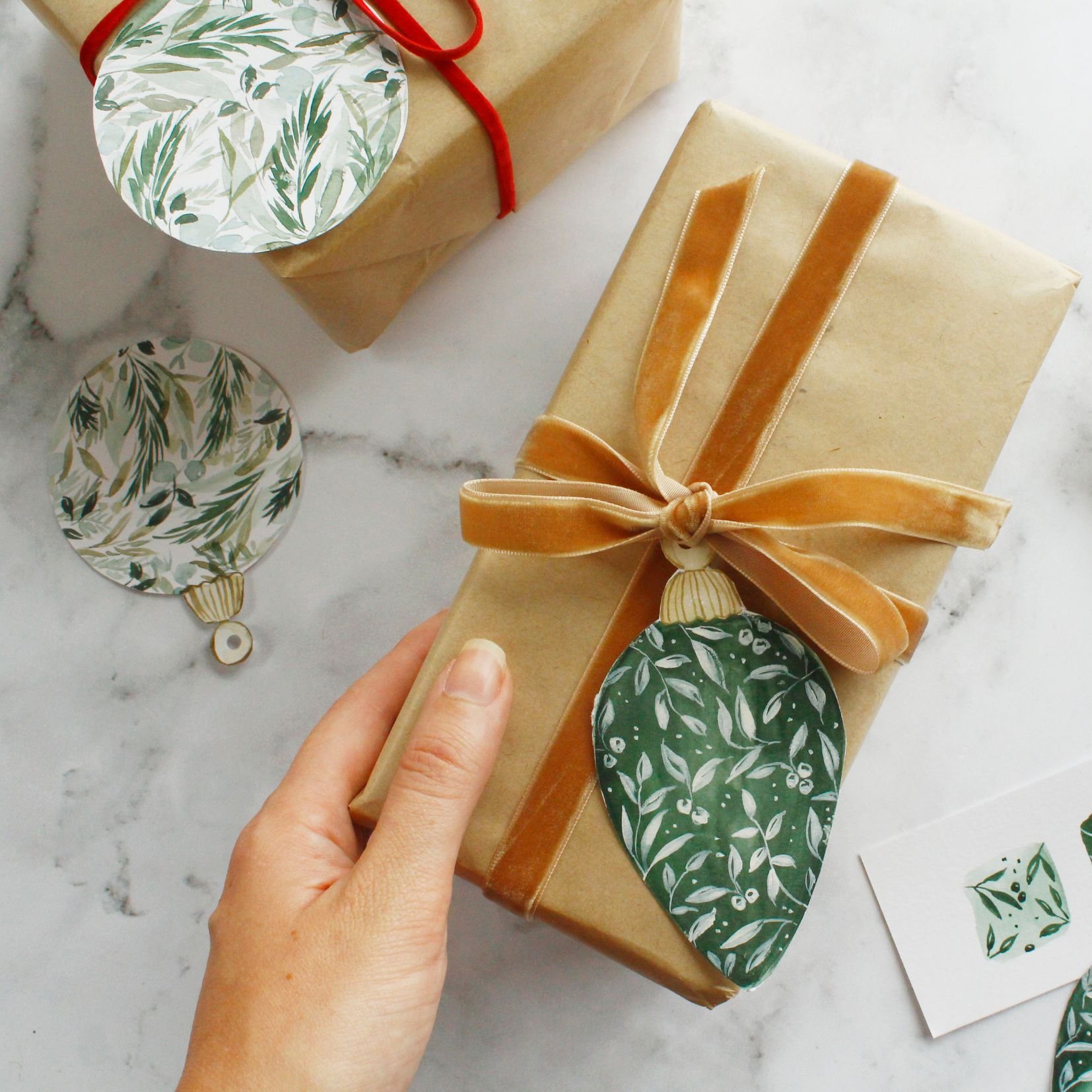    Learn to paint your own bauble-shaped watercolour tags and wreath Christmas card   