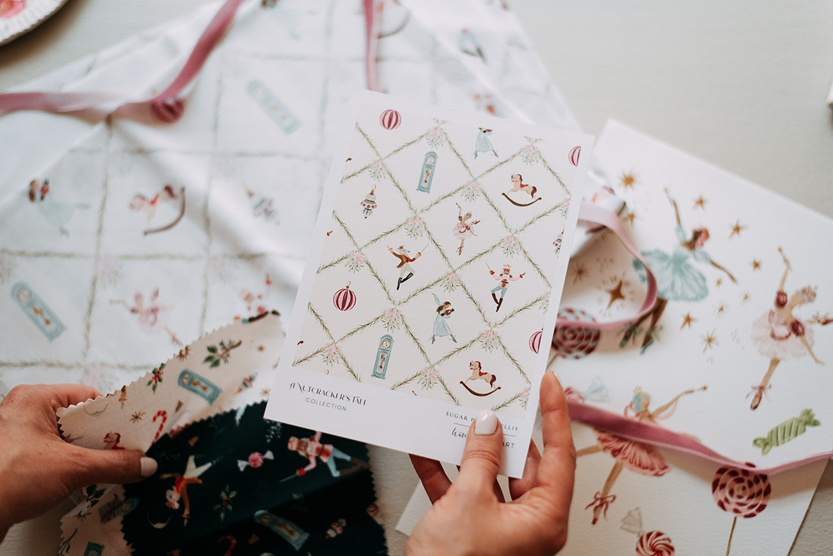 Surface pattern design sell sheet sample in artist's hand